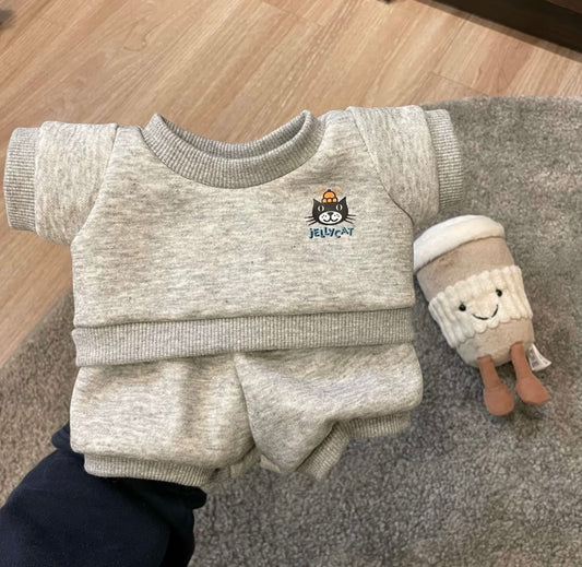 Grey Jellycat sweatshirt and shorts flat lay with coffee cup plush