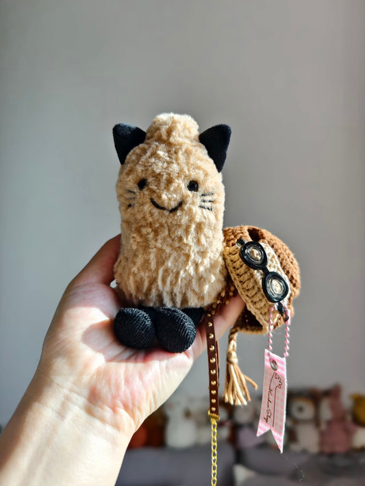 Aviator cat plush wearing helmet and goggles, front view