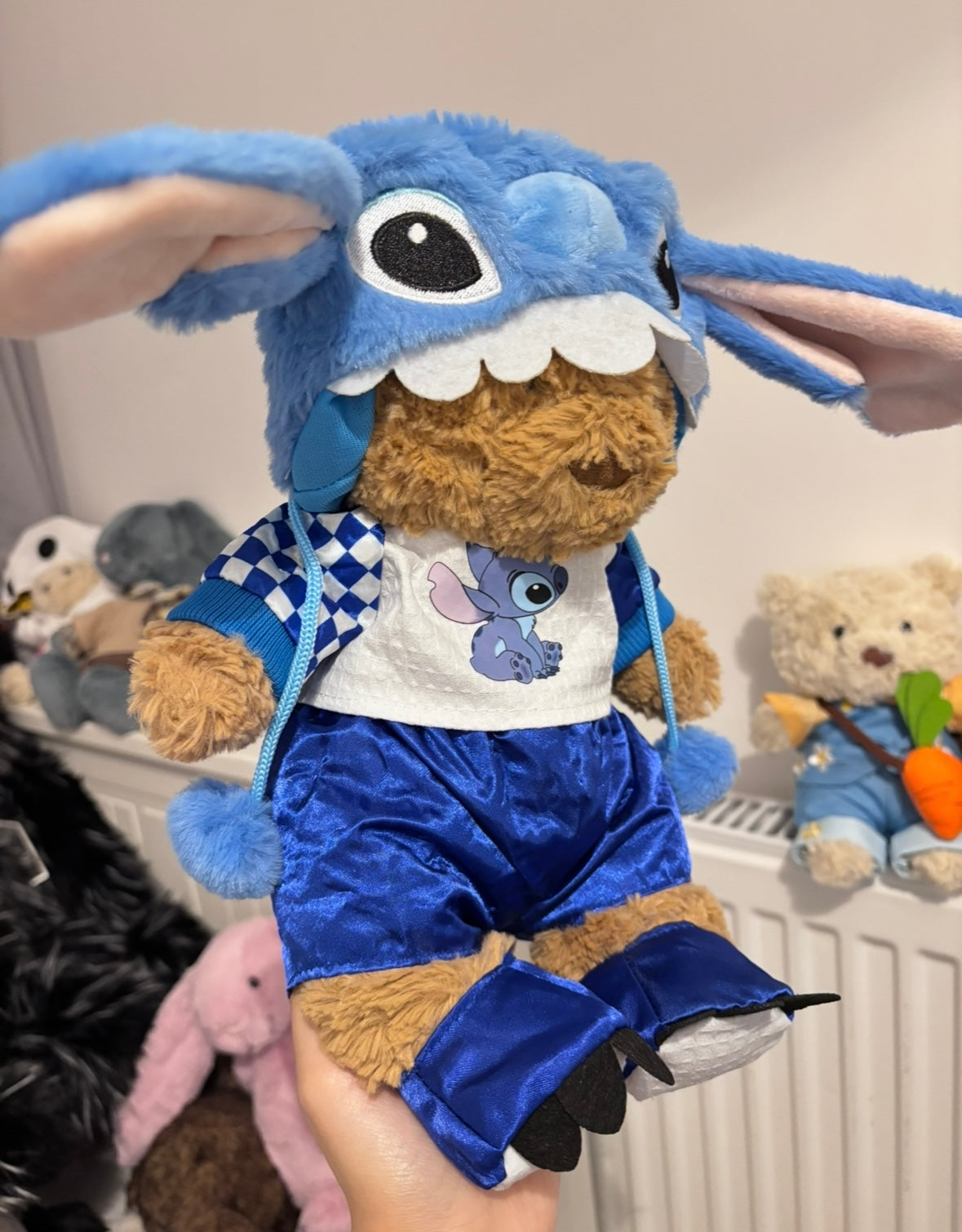 Bartholomew Bear Stitch fan set - full body view with plush toys in background