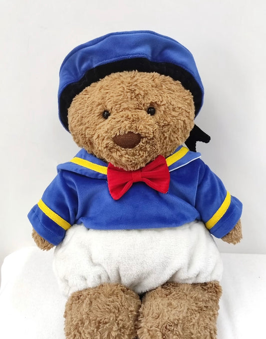 Bartholomew Bear wearing blue sailor set with red bow tie and blue beret - front view