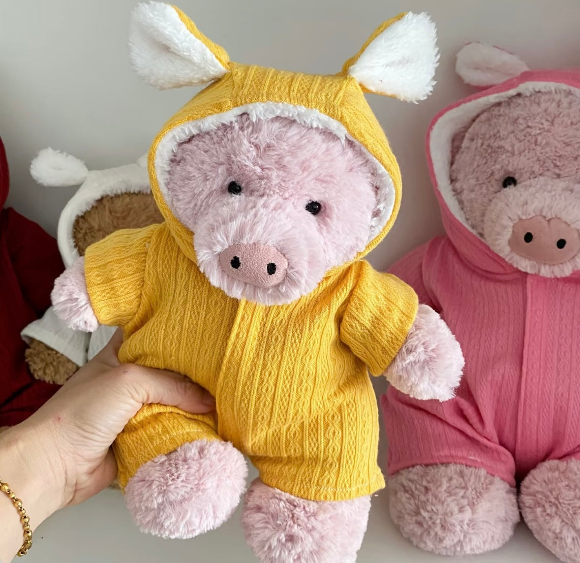 Bunny-ear hooded romper colour range on plush toys