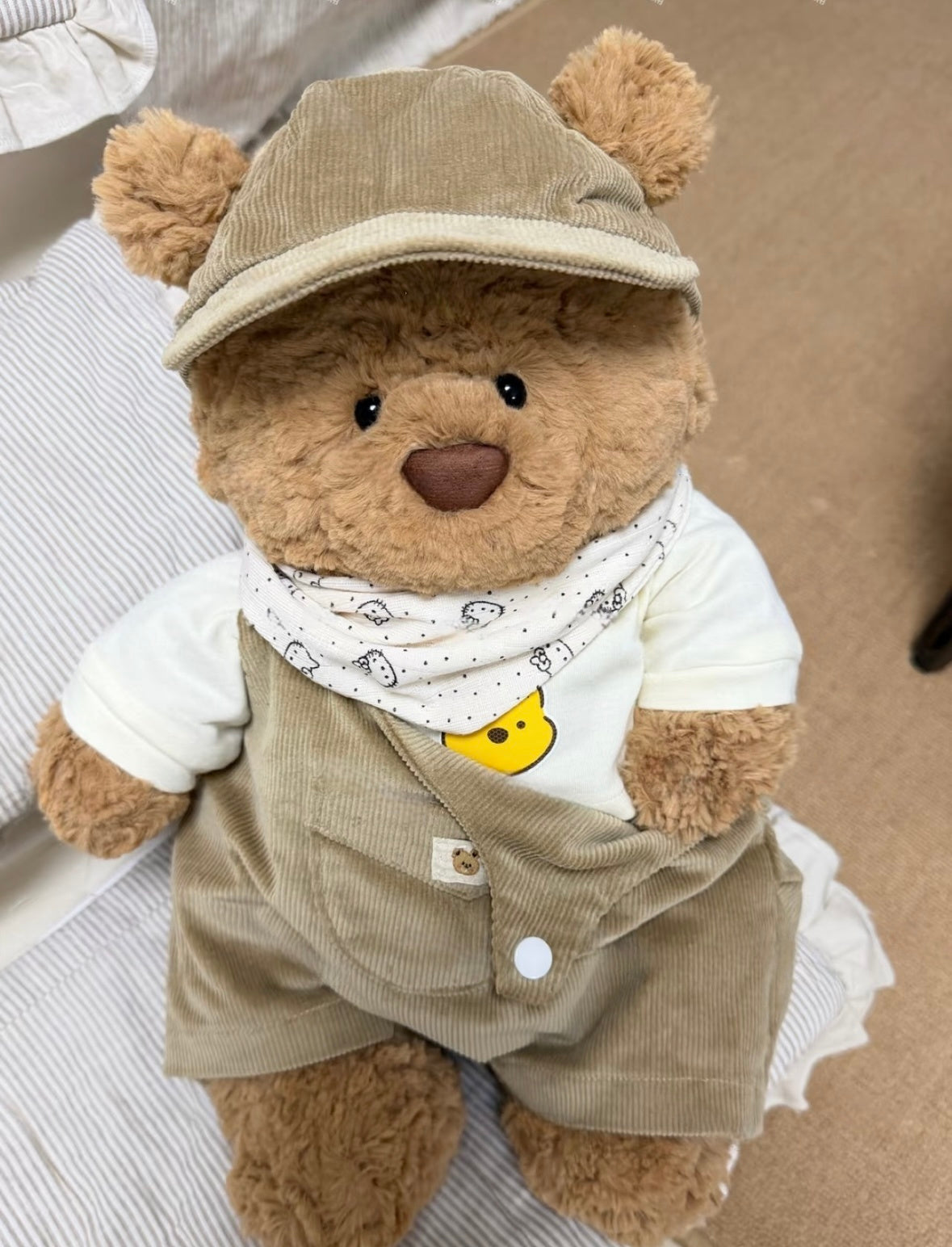 Bartholomew Bear in the yellow corduroy outfit with cap and bandana