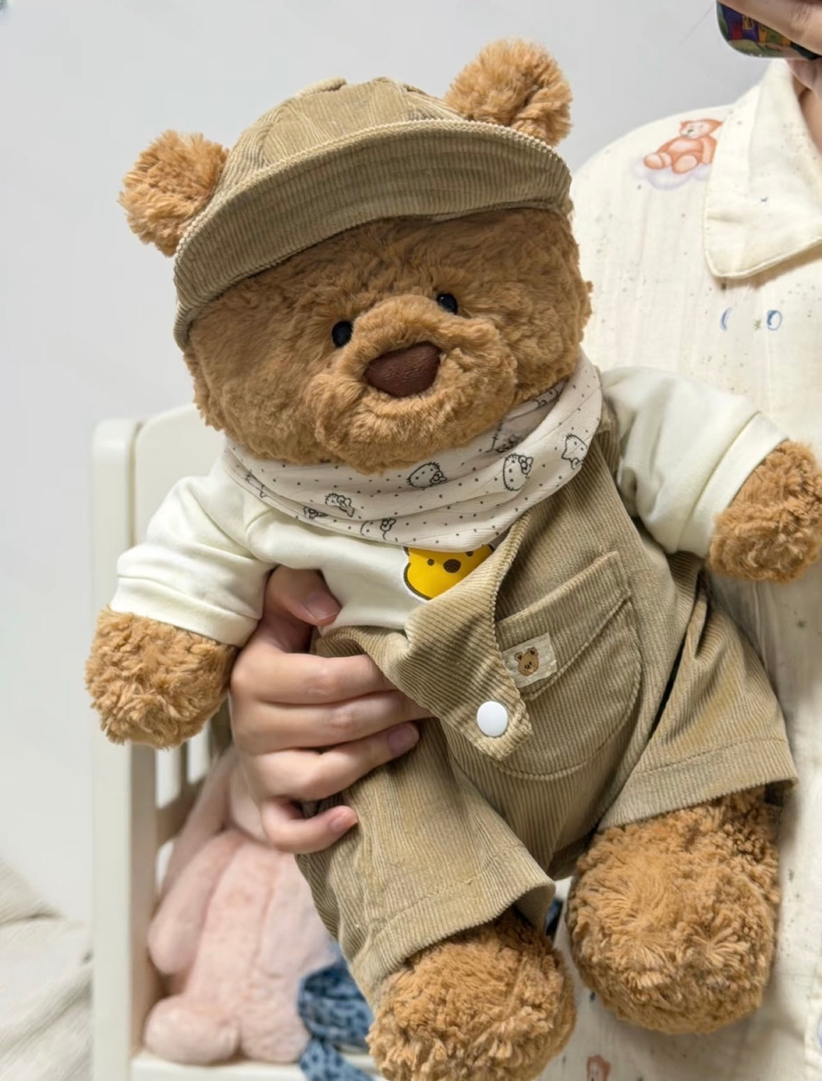 Bartholomew Bear wearing the green corduroy outfit with white top and printed bandana
