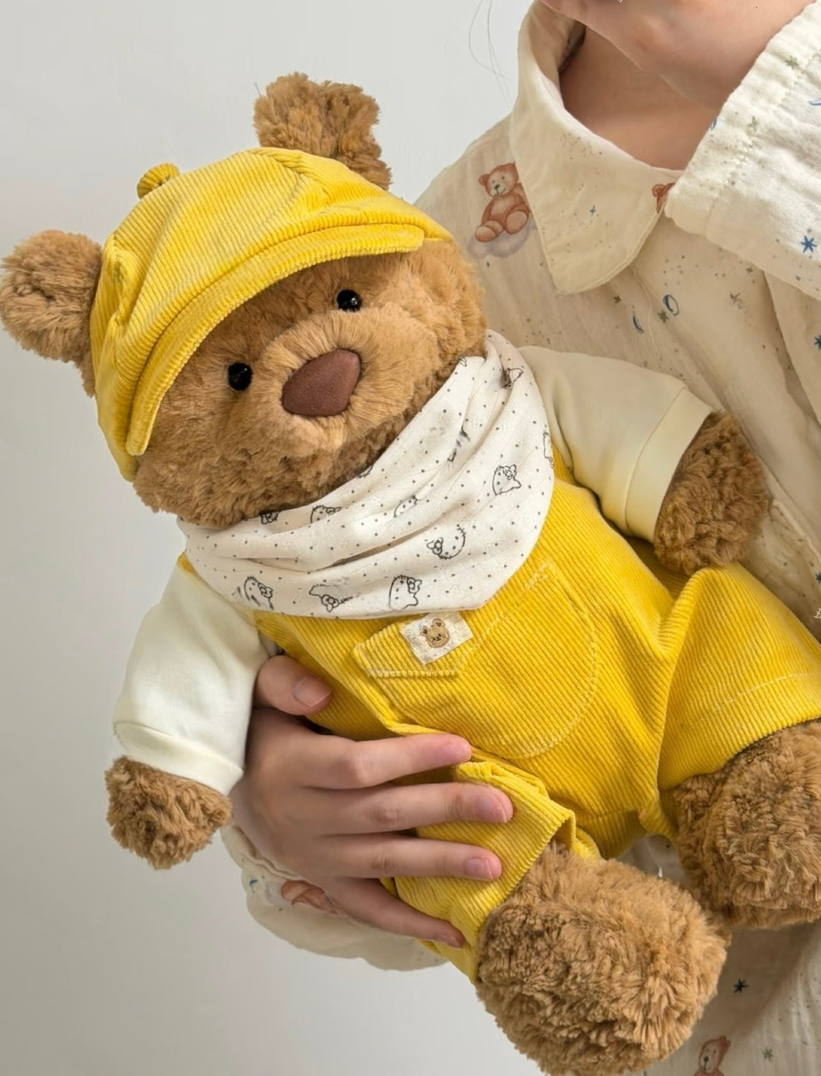 Bartholomew Bear wearing the beige corduroy outfit with matching cap and printed bandana