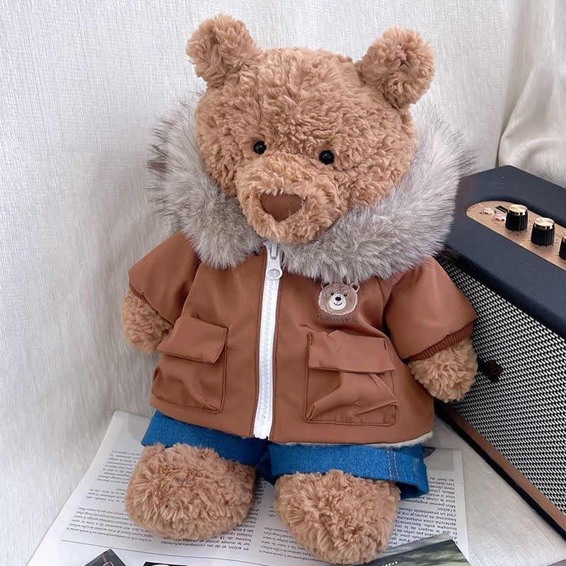 Bartholomew Bear wearing a caramel brown fur-hood parka and denim shorts