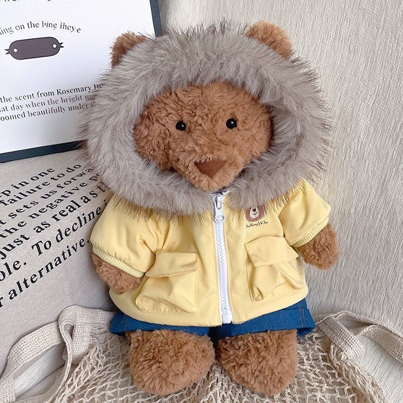Bartholomew Bear in the brown parka with the faux-fur hood worn down as a collar