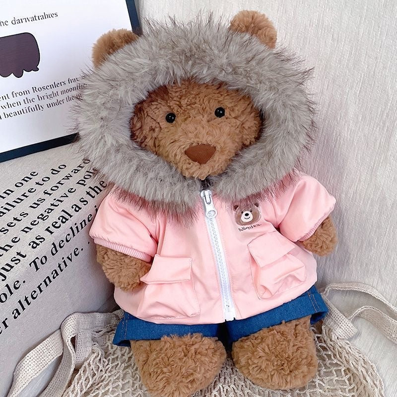 Bartholomew Bear wearing a baby blue fur-hood parka and denim shorts