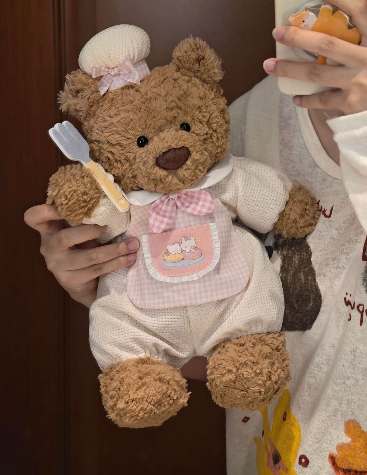 Bartholomew Bear wearing blue Little Chef romper set with gingham apron and fork