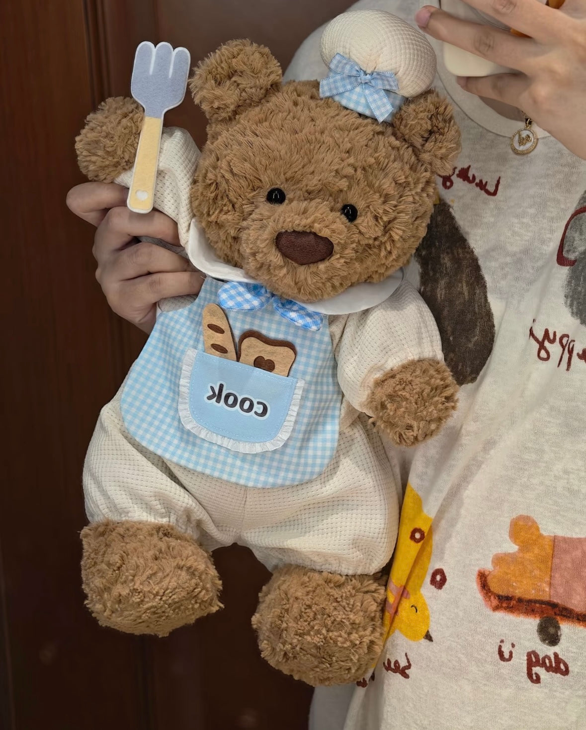 Two Bartholomew Bears wearing Little Chef romper sets — blue and pink colourways