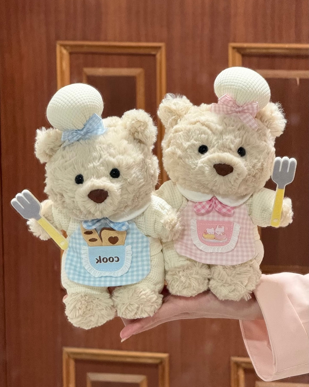 Bartholomew Bear in pink Little Chef romper set, front view