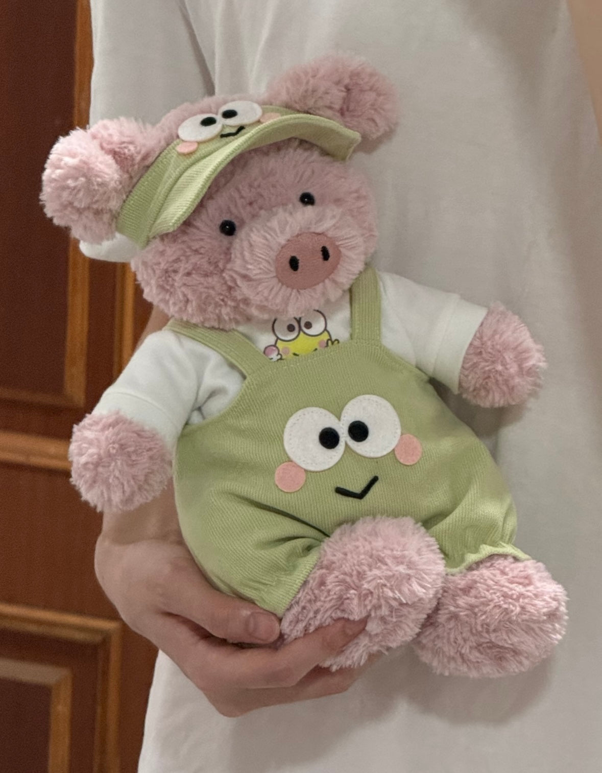 Brown bear plush wearing frog dungaree set - detail view