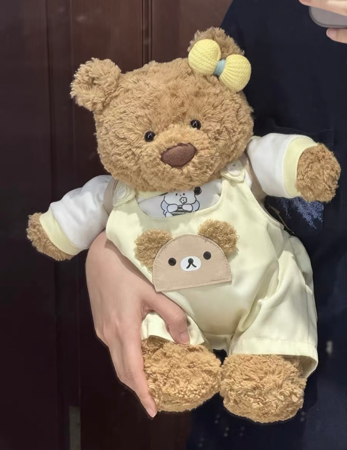 Bartholomew Bear wearing butter yellow dungaree set, front view
