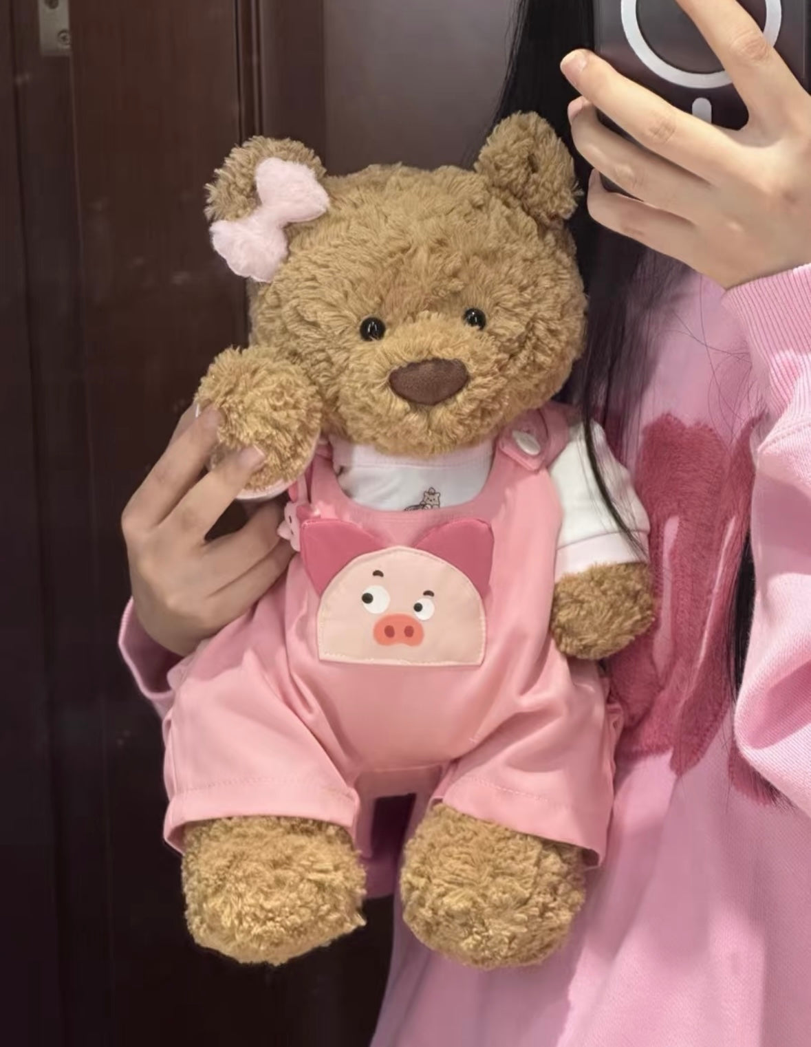 Bartholomew Bear wearing pink piggy dungaree set, front view