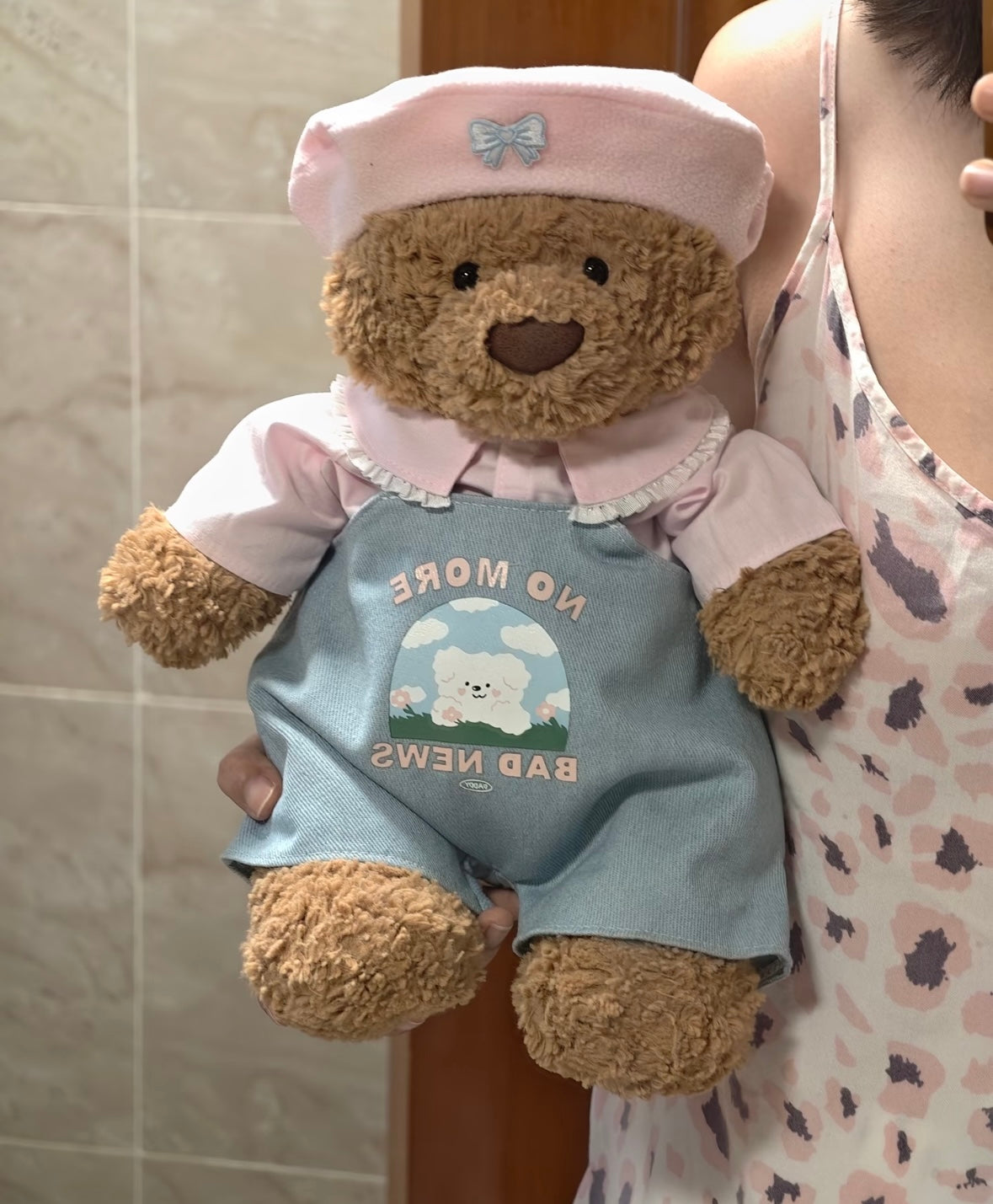 Bartholomew Bear wearing No More Bad News dungaree set - front view