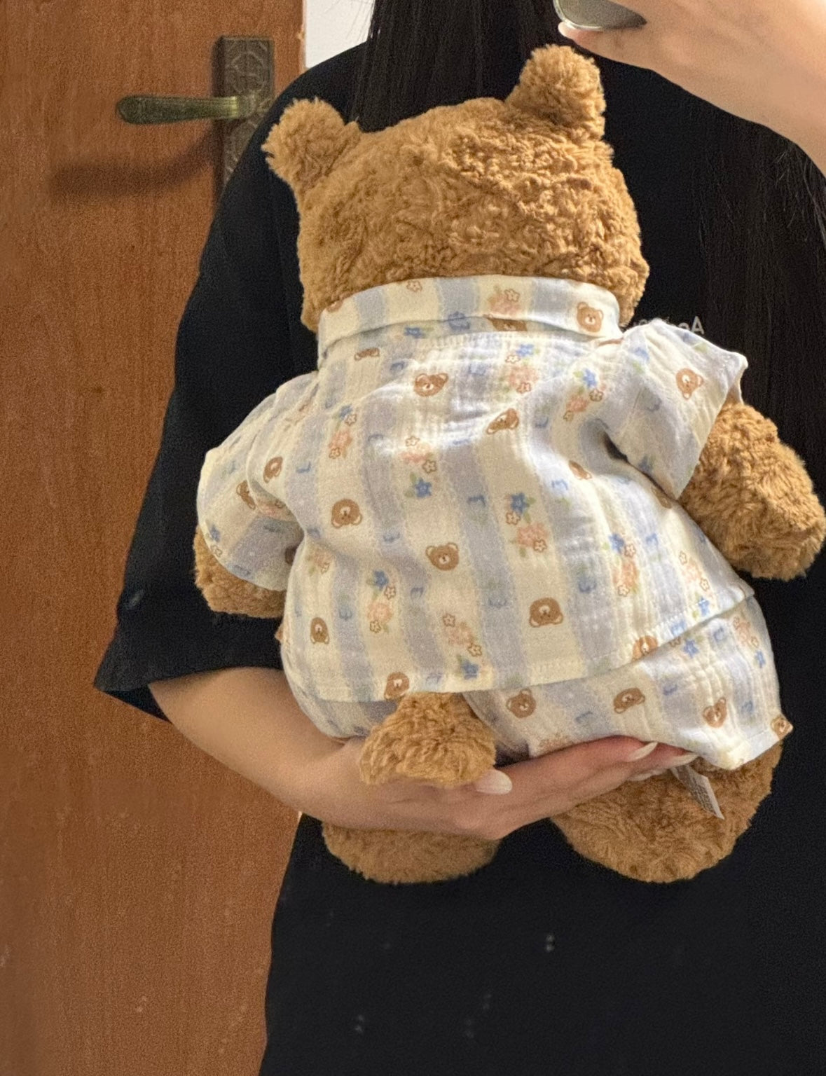 Bartholomew Bear wearing blue gingham bear print pyjama set, close-up front view