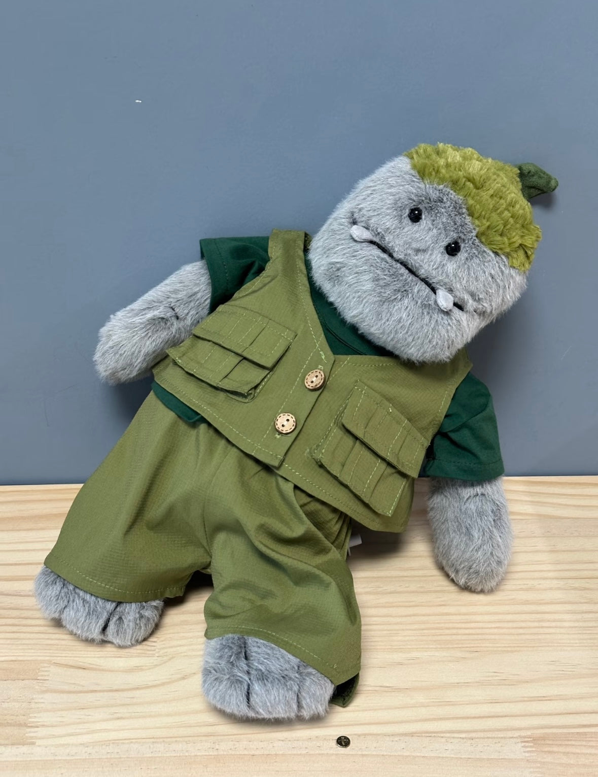 Rockleton in green cargo vest and shorts outdoors
