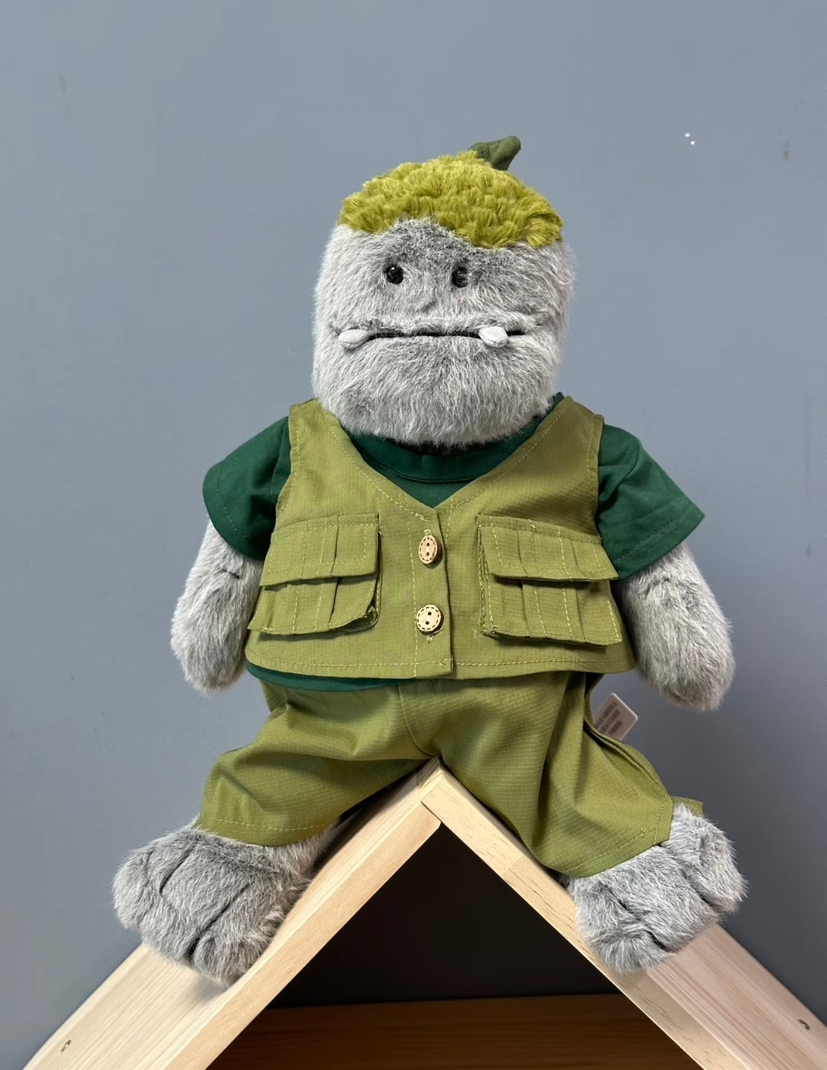 Rockleton in full safari explorer set sitting on wooden ledge