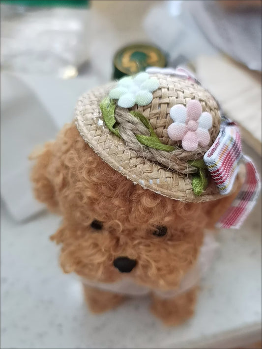 Jellycat wearing mini straw hat with floral bow