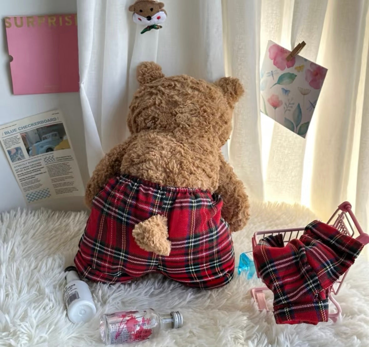 Jellycat bear wearing red tartan pyjama trousers back view