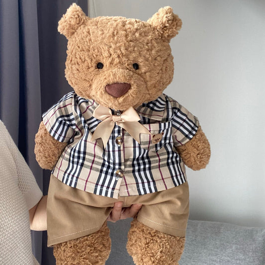 Bartholomew Bear wearing heritage check shirt with bow tie and khaki shorts front view