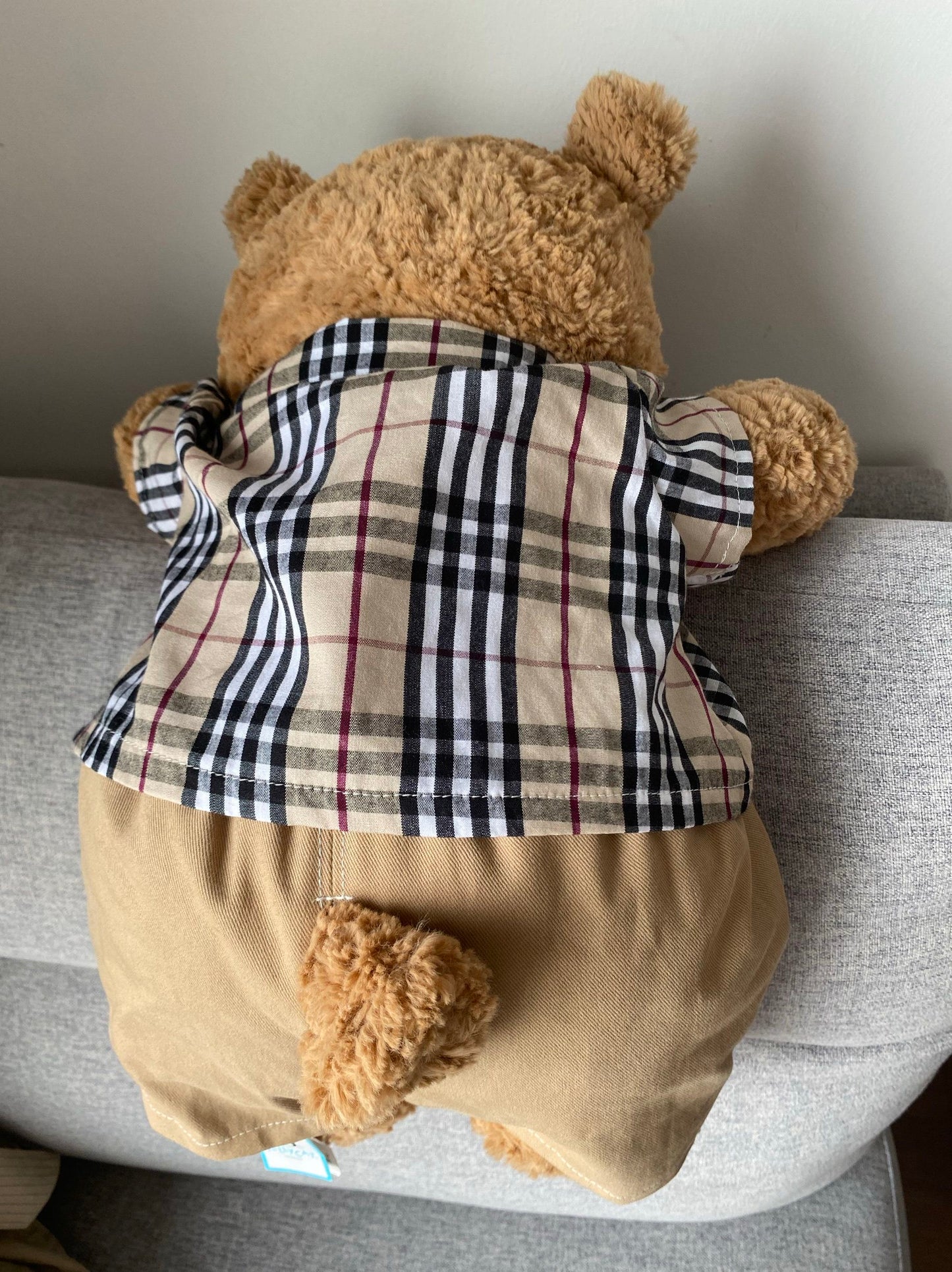 Bartholomew Bear wearing heritage check shirt and khaki shorts back view