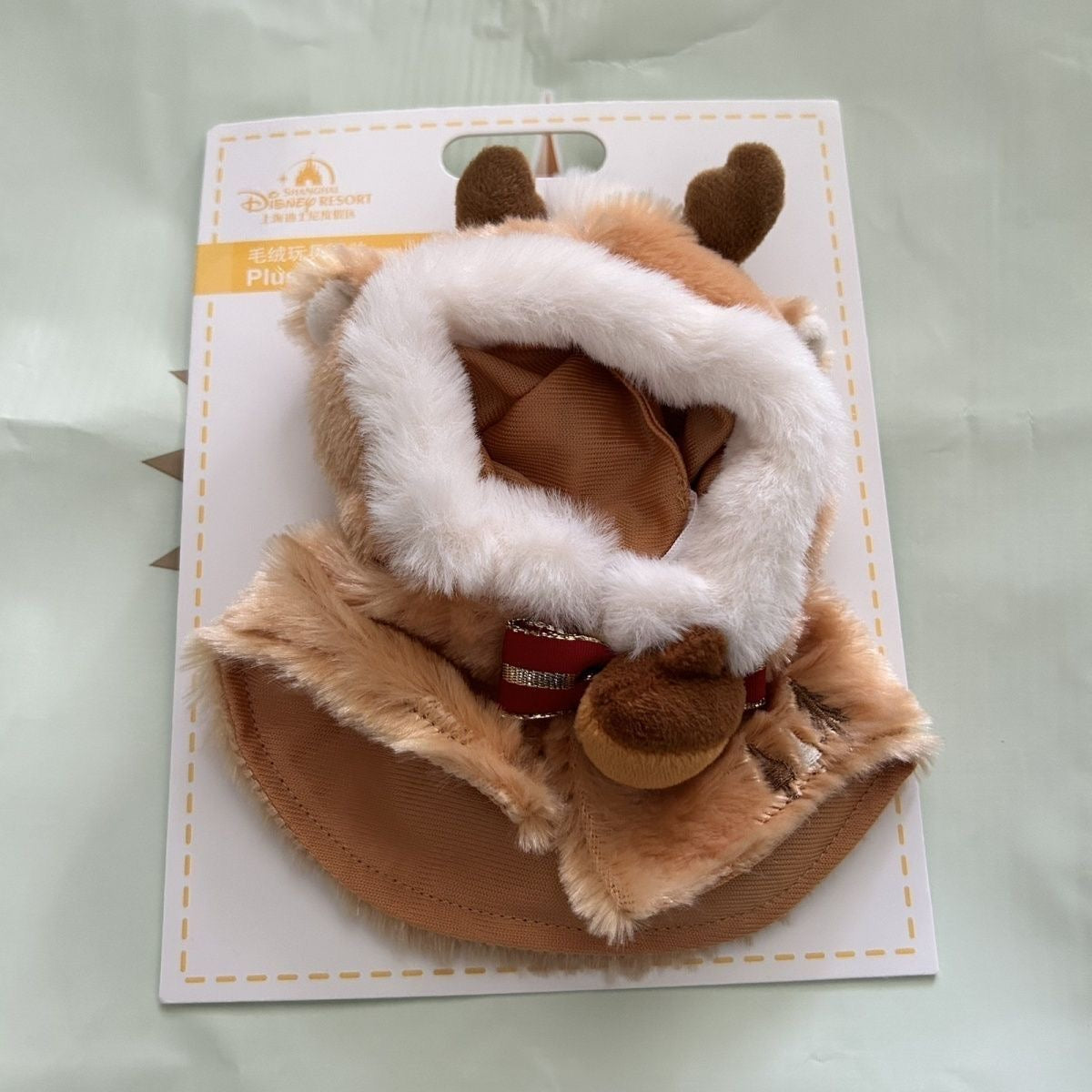 Reindeer cape set laid flat on packaging card
