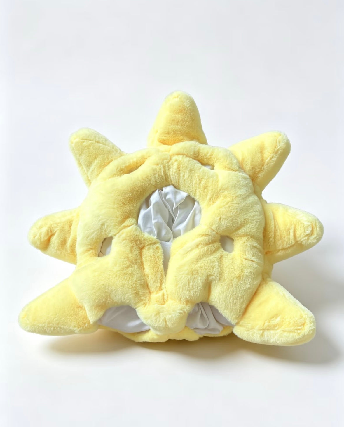 Sunshine costume laid flat showing the back with central satin-lined opening and eight padded sun rays