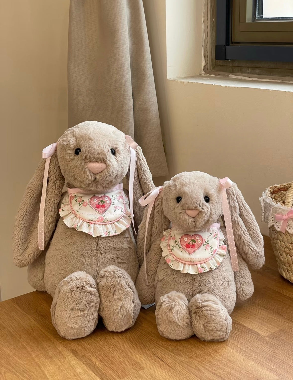 Pink Bashful Bunny wearing Cherry Heart Bib - hanging display