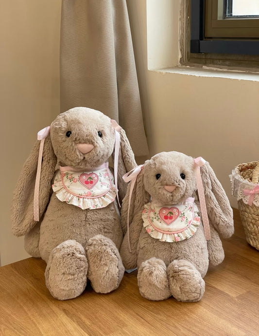 Pink Bashful Bunny wearing Cherry Heart Bib - hanging display