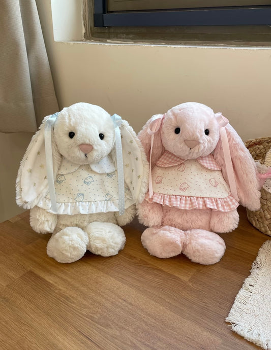 White and pink Bashful Bunnies both wearing bunny print dresses - seated together