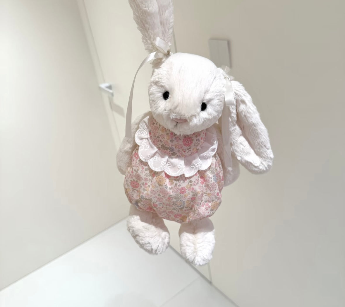 Bashful Bunny floral romper set - full body hanging view with ear ribbon ties