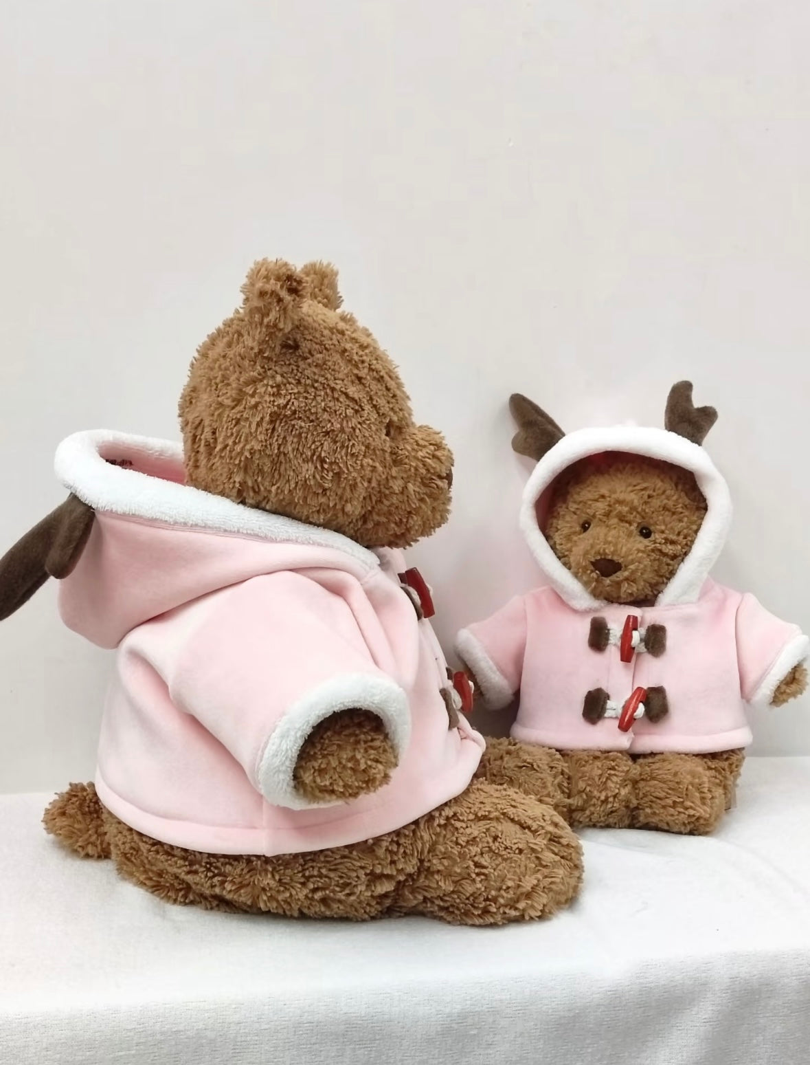 Small Bartholomew Bear back view and Reindeer front view in pink duffle coats - back detail