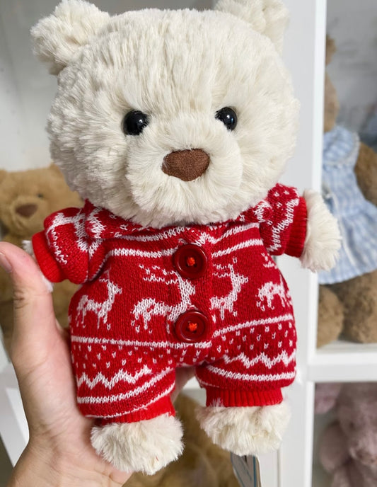 White bear wearing red Nordic reindeer knit romper, front view