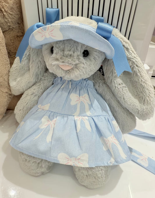 Bashful Bunny wearing baby blue bow-print tiered dress with matching sun hat, front view