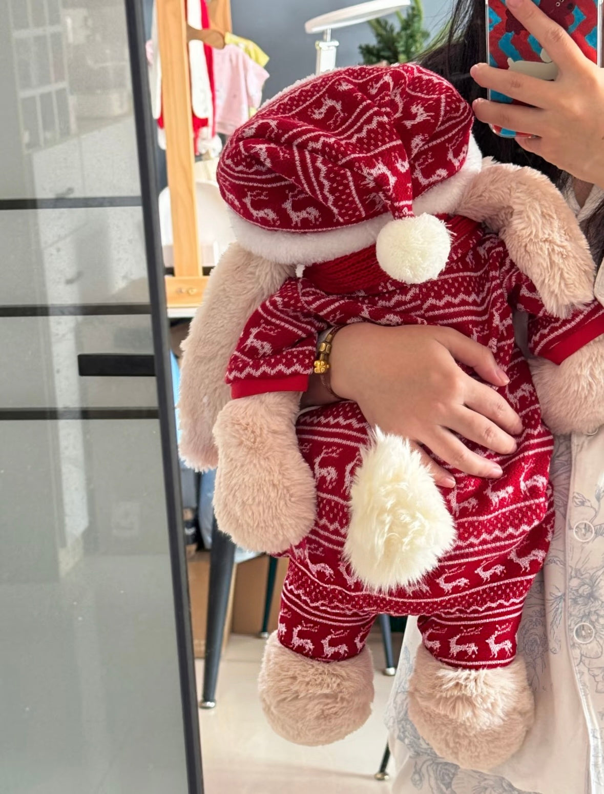Back view of Bashful Bunny in full red reindeer knit set showing bloomers and Santa hat pompom