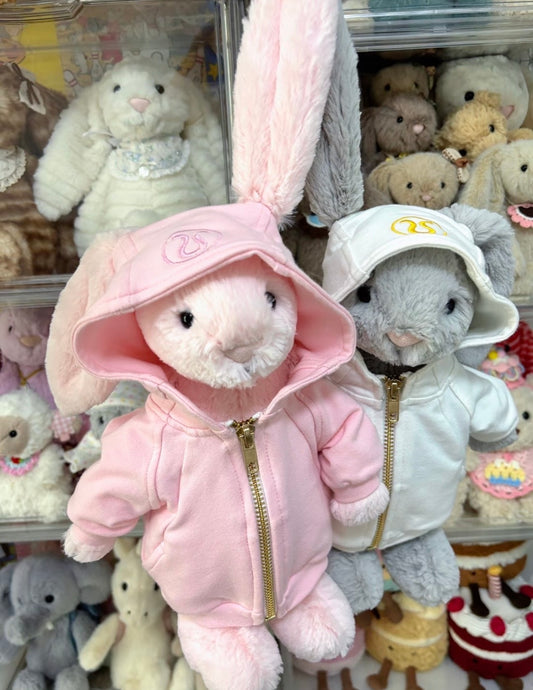 Bashful Bunny tracksuit in pink and grey colourways side by side