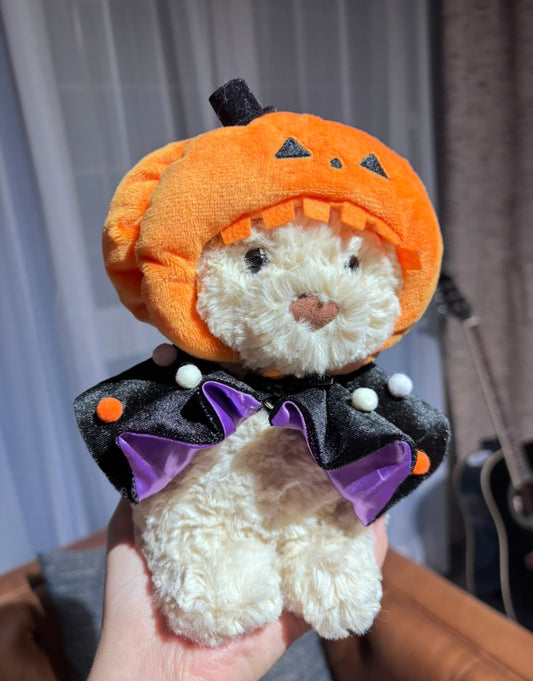 Close-up of orange pumpkin hat top with fabric stem detail