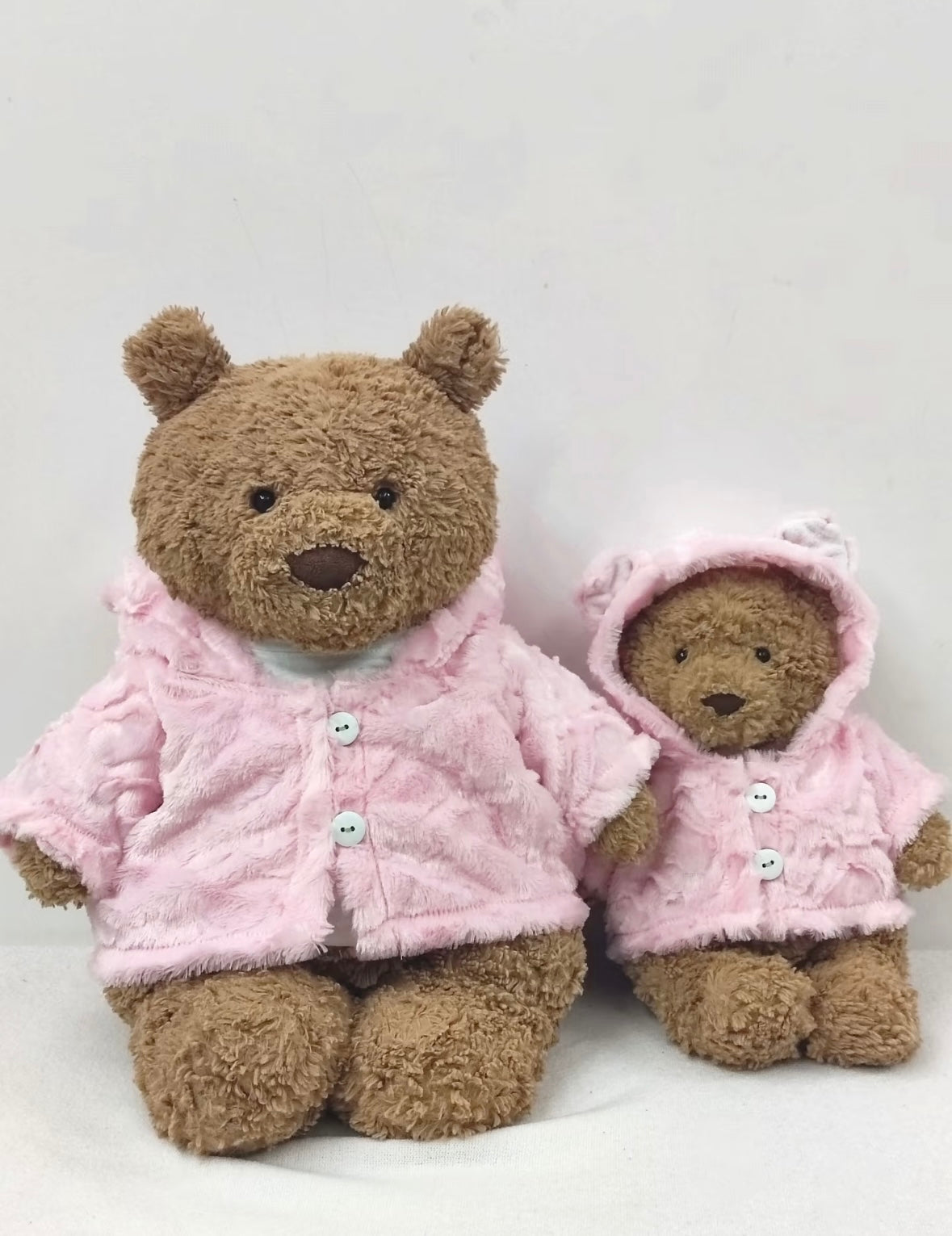 Back view of two Bartholomew Bears in pink faux fur coats
