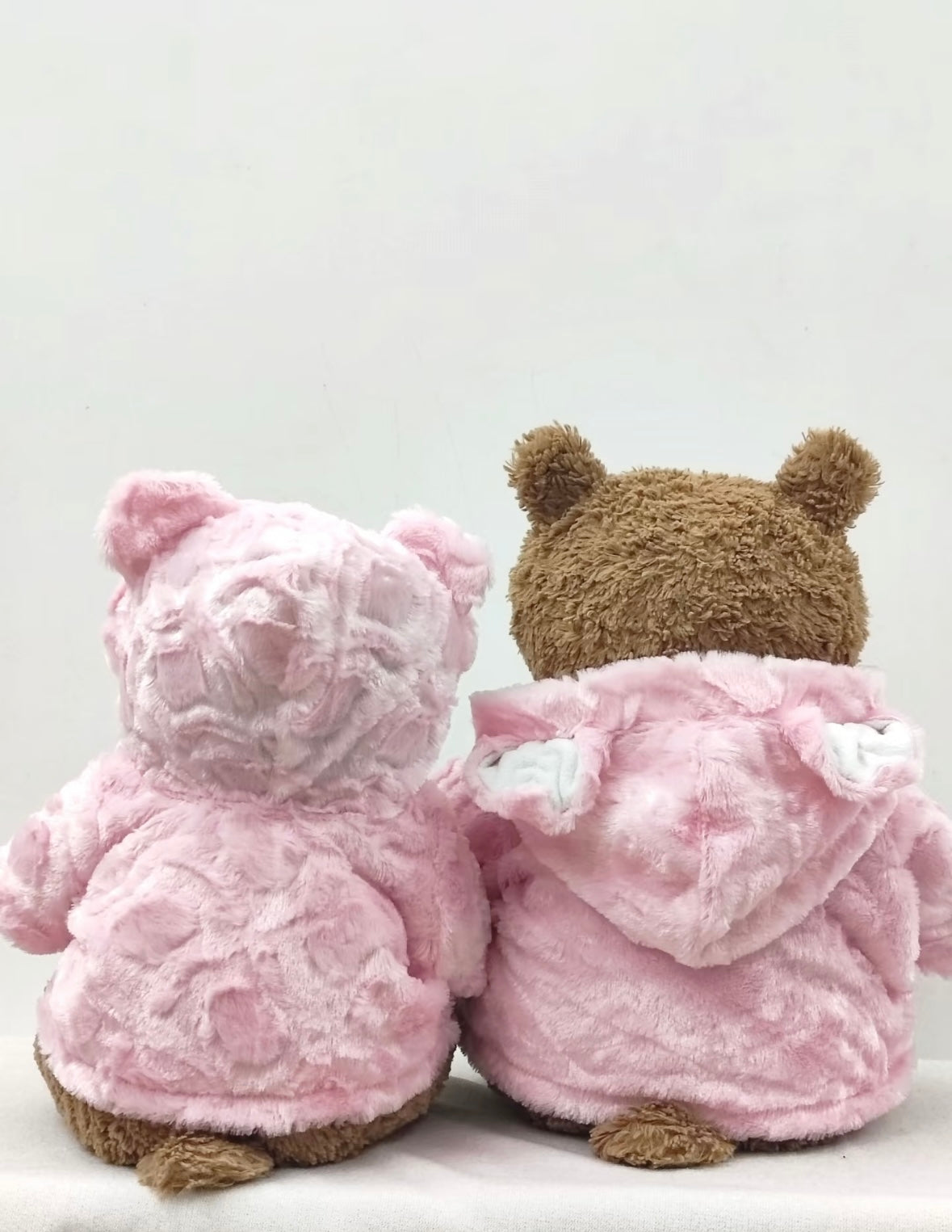 Front view of two Bartholomew Bears wearing pink fluffy coats