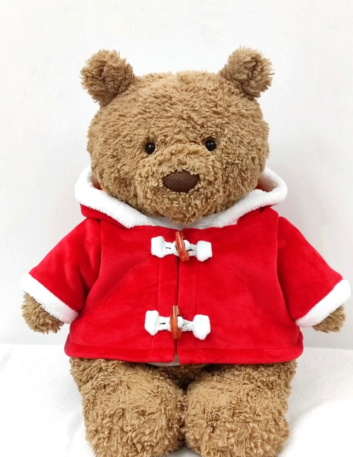Back and side view of two Bartholomew Bears in red Santa duffle coats